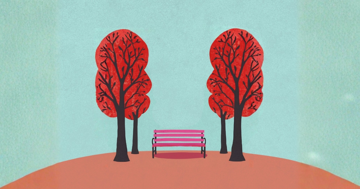 panchina rossa fra due alberi rossi 