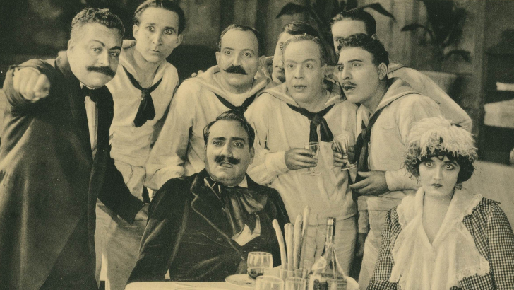 My cousin, lobbycard, Enrico C​aruso (sitting, center), 1918